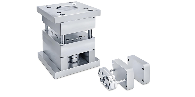 Precision machined mold base showing flat surfaces and accurately positioned holes